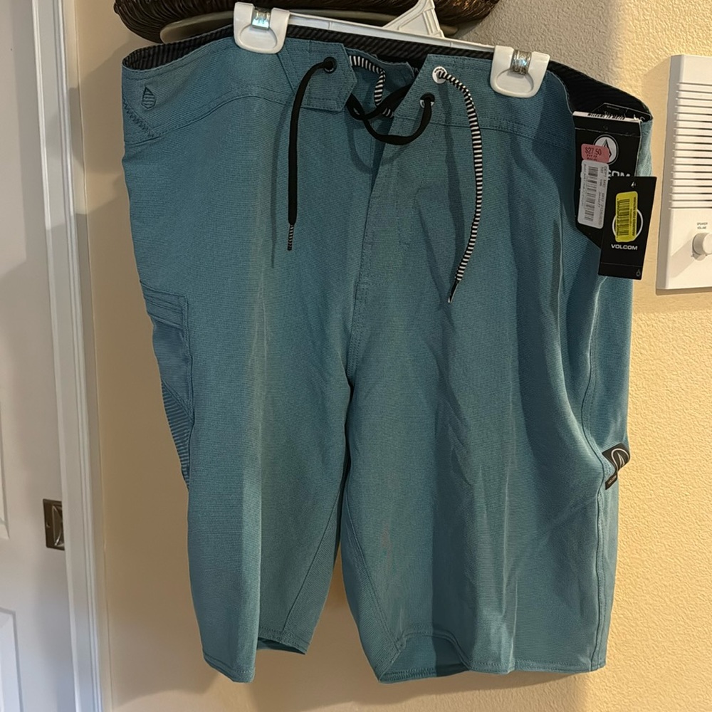 1 pair Hurley swim shorts and 1 pair Volcom swim shorts